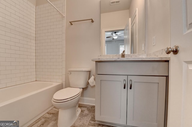 bathroom with a ceiling fan, vanity, baseboards, toilet, and visible vents
