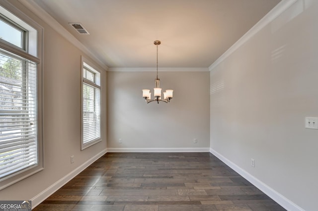 unfurnished room with a chandelier, visible vents, crown molding, and dark wood-style flooring