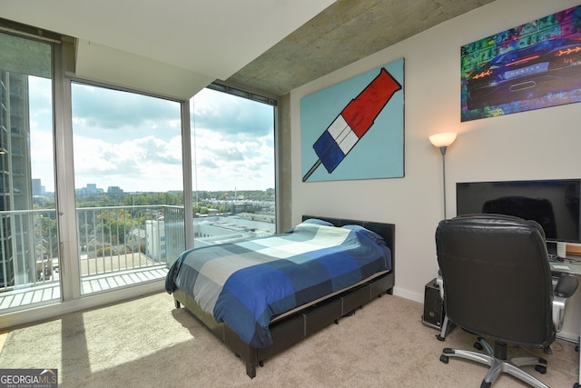 361 17th St NW Unit 1107, Atlanta, GA 30363 - bedroom featuring floor to ceiling windows, a view of city, carpet, access to exterior, and an office area