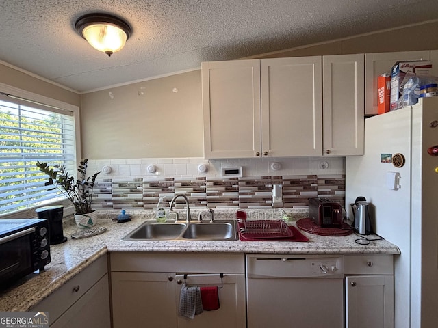 63 Breezewood Dr, Hampton, GA 30228 - kitchen with backsplash, white appliances, a textured ceiling, ornamental molding, and white cabinets