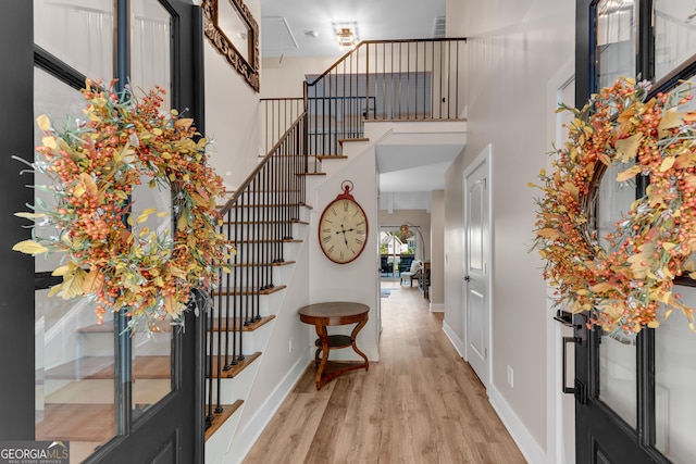 10005 Lakeview Pkwy, Villa Rica, GA 30180 - foyer entrance with wood finished floors, stairway, and baseboards