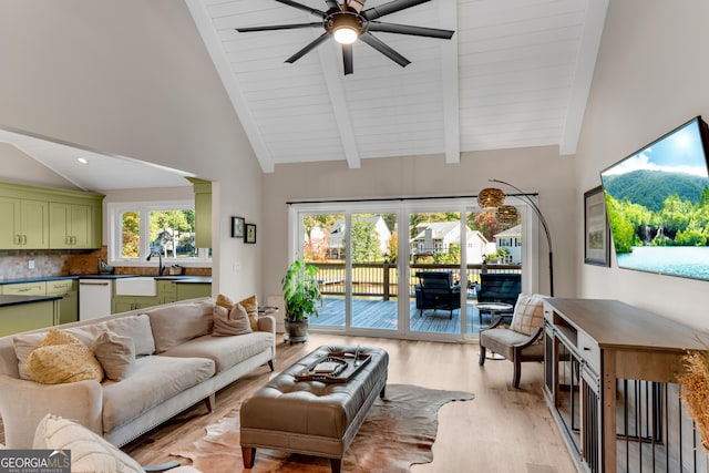 10005 Lakeview Pkwy, Villa Rica, GA 30180 - living room featuring light wood-style floors, ceiling fan, beamed ceiling, and high vaulted ceiling