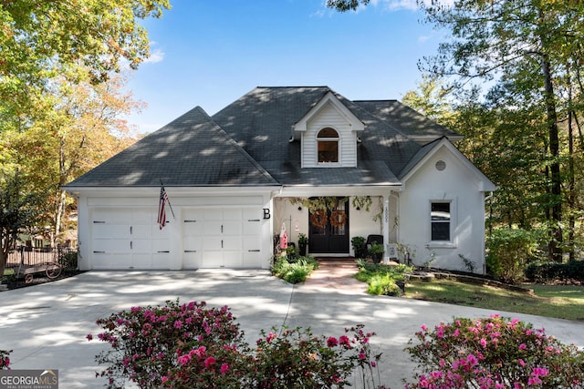 10005 Lakeview Pkwy, Villa Rica, GA 30180 - view of front of house with an attached garage, french doors, driveway, stucco siding, and a shingled roof