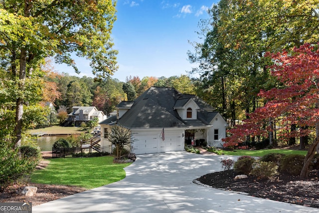 10005 Lakeview Pkwy, Villa Rica, GA 30180 - view of front facade featuring a garage, concrete driveway, a front lawn, and view of scattered trees