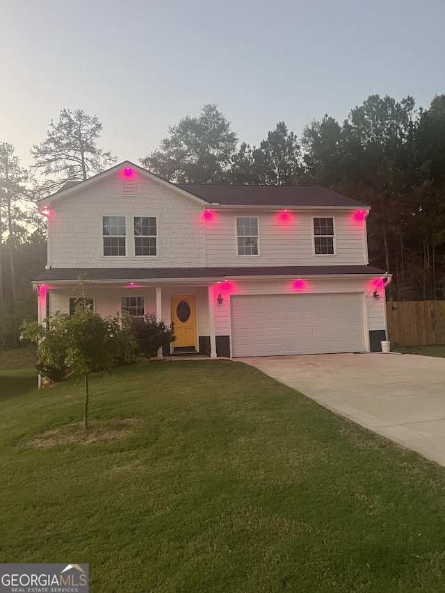 view of front of property with an attached garage and concrete driveway