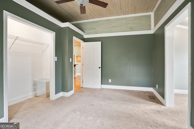 unfurnished bedroom with baseboards, wooden ceiling, visible vents, and carpet floors