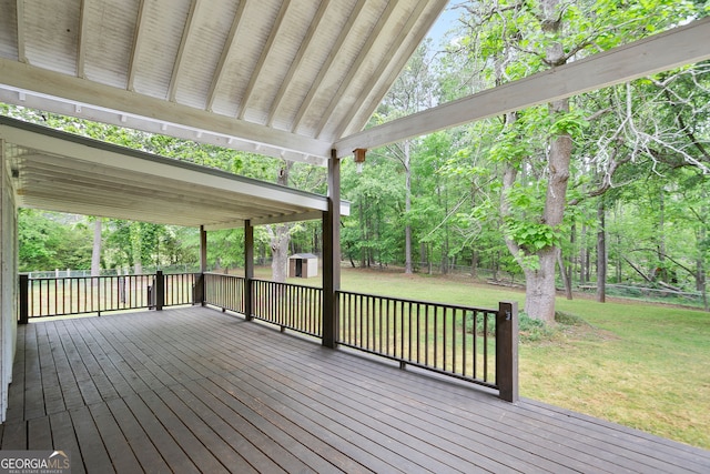 wooden terrace with a lawn