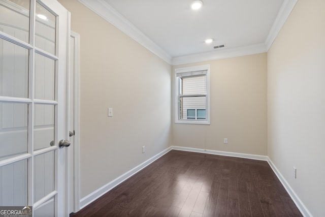 empty room with crown molding, baseboards, dark wood-style flooring, visible vents, and recessed lighting