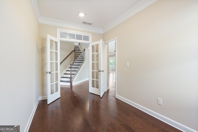 unfurnished room featuring french doors, baseboards, visible vents, stairs, and crown molding