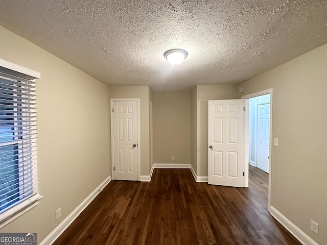 2965 Meadowview Dr SE, Atlanta, GA 30316 - unfurnished bedroom featuring wood finished floors, a textured ceiling, and baseboards