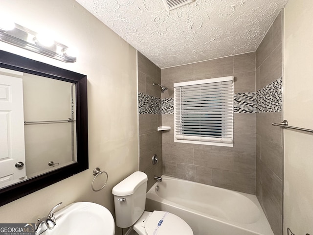 2965 Meadowview Dr SE, Atlanta, GA 30316 - full bathroom featuring a sink, a textured ceiling, toilet, visible vents, and shower / bath combination