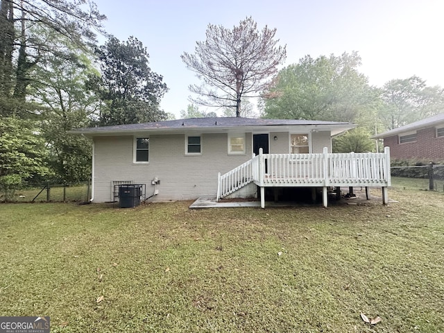 2965 Meadowview Dr SE, Atlanta, GA 30316 - rear view of house featuring fence, a yard, cooling unit, a wooden deck, and brick siding