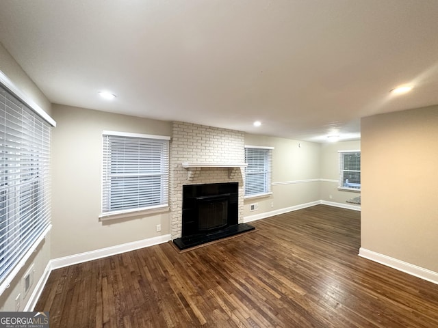 2965 Meadowview Dr SE, Atlanta, GA 30316 - unfurnished living room with plenty of natural light, baseboards, visible vents, wood finished floors, and a fireplace