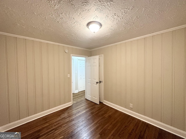 2965 Meadowview Dr SE, Atlanta, GA 30316 - unfurnished room featuring baseboards, a textured ceiling, dark wood-type flooring, and ornamental molding