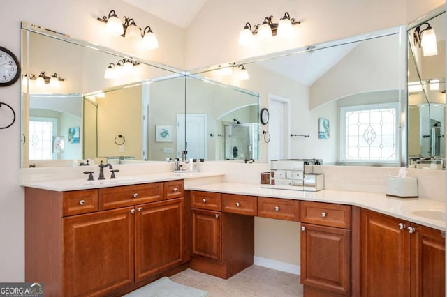 455 Cooper Woods Ct SE, Smyrna, GA 30082 - bathroom with lofted ceiling, a stall shower, tile patterned floors, and double vanity