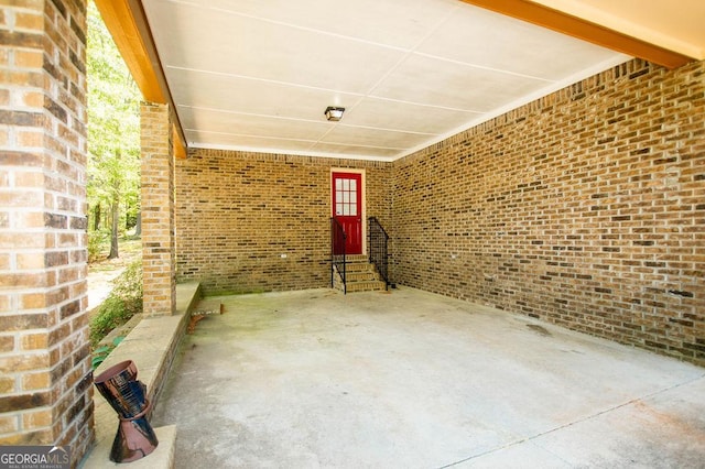 view of patio featuring entry steps and an attached carport
