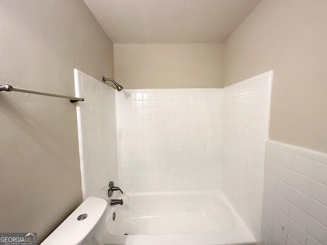bathroom with toilet and bathtub / shower combination