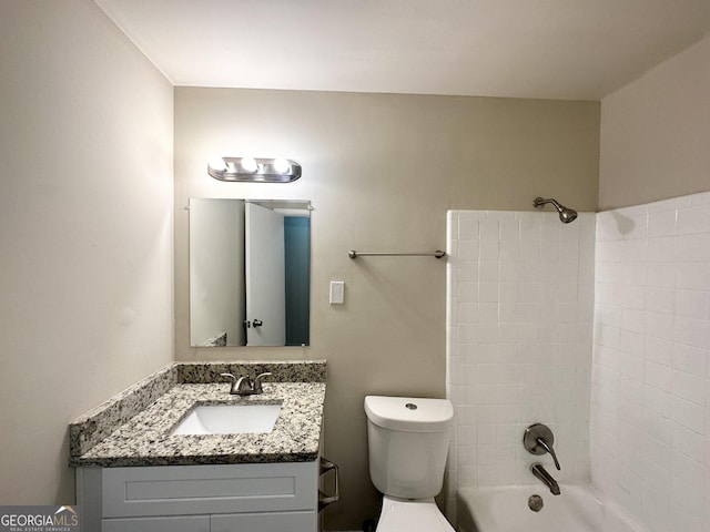 full bath featuring toilet, vanity, and shower / washtub combination