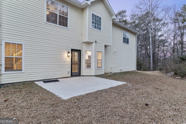 back of property with a patio area