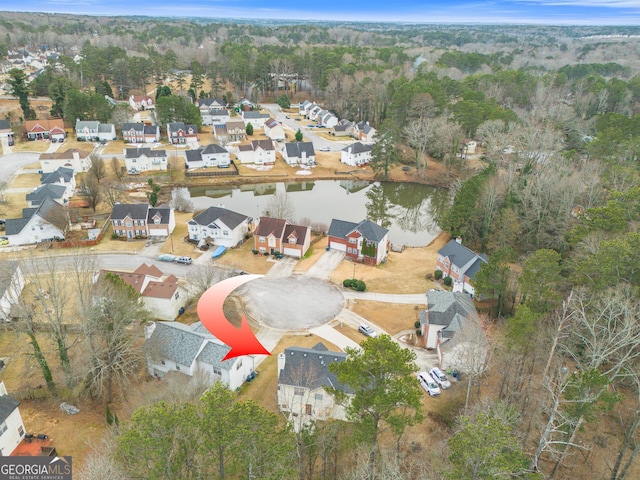 bird's eye view featuring a residential view and a water view