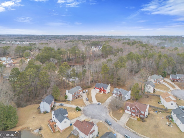 birds eye view of property featuring a residential view and a forest view