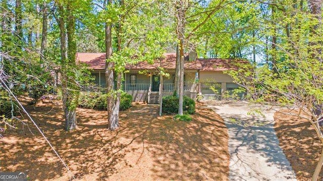 255 White Pines Dr, Alpharetta, GA 30004 - obstructed view of property featuring a porch and stairs