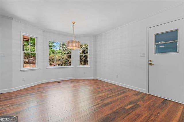 255 White Pines Dr, Alpharetta, GA 30004 - empty room featuring wood finished floors, a wealth of natural light, and an inviting chandelier