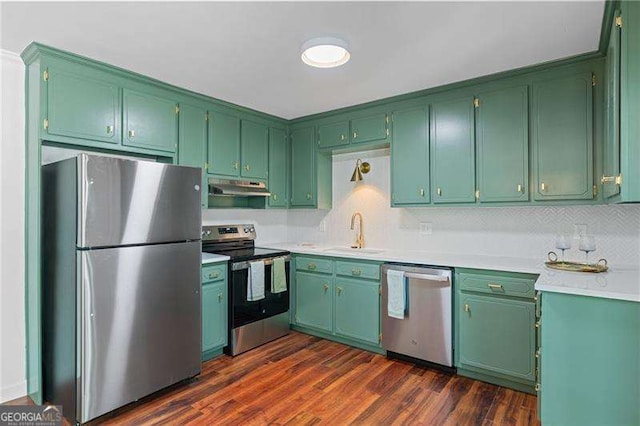 255 White Pines Dr, Alpharetta, GA 30004 - kitchen with a sink, appliances with stainless steel finishes, light countertops, under cabinet range hood, and dark wood-type flooring