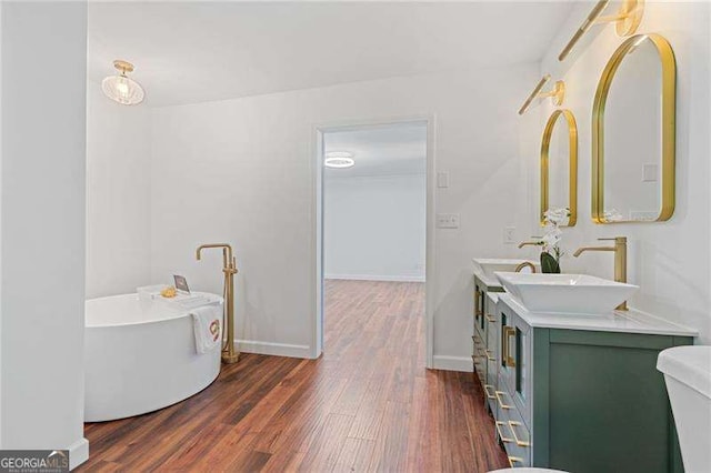 255 White Pines Dr, Alpharetta, GA 30004 - full bath featuring baseboards, wood finished floors, vanity, and a freestanding bath