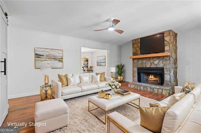 255 White Pines Dr, Alpharetta, GA 30004 - living area featuring wood finished floors, ceiling fan, a fireplace, baseboards, and ornamental molding