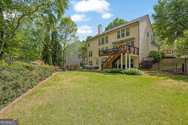 rear view of property with a chimney, stairs, fence, a wooden deck, and a lawn