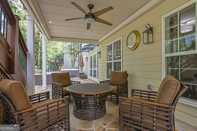 view of patio with a hot tub and ceiling fan