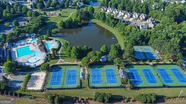 birds eye view of property with a water view