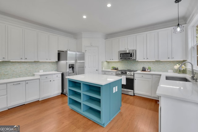 kitchen featuring open shelves, stainless steel appliances, a sink, and white cabinetry