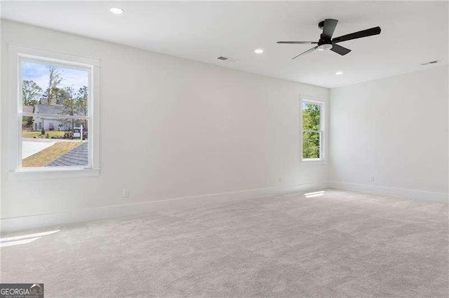 empty room featuring recessed lighting, carpet floors, baseboards, and ceiling fan