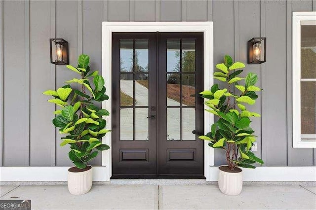 entrance to property featuring board and batten siding and french doors