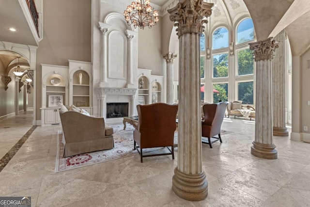 720 Heards Ferry Rd, Atlanta, GA 30328 - interior space with baseboards, a high ceiling, built in features, and ornate columns
