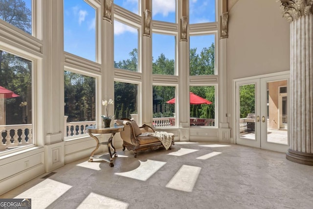 720 Heards Ferry Rd, Atlanta, GA 30328 - sunroom with a high ceiling, visible vents, french doors, and a decorative wall