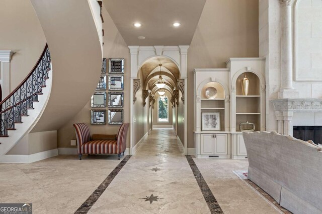 720 Heards Ferry Rd, Atlanta, GA 30328 - corridor featuring baseboards, recessed lighting, ornate columns, a high ceiling, and stairs