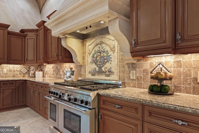 720 Heards Ferry Rd, Atlanta, GA 30328 - kitchen with light stone countertops, custom range hood, decorative backsplash, and range with two ovens