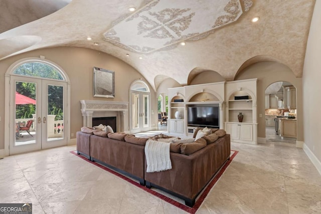 720 Heards Ferry Rd, Atlanta, GA 30328 - living room featuring french doors, baseboards, built in features, recessed lighting, and a fireplace
