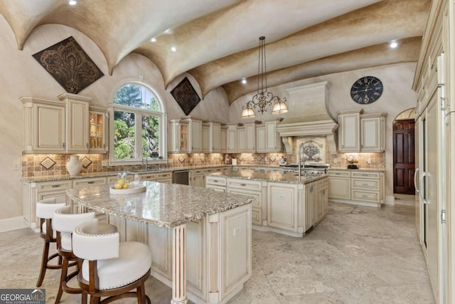 720 Heards Ferry Rd, Atlanta, GA 30328 - kitchen featuring premium range hood, cream cabinetry, and an island with sink