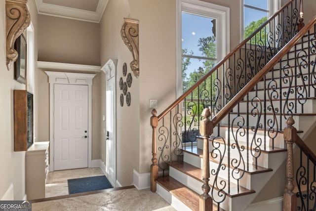 720 Heards Ferry Rd, Atlanta, GA 30328 - foyer featuring baseboards, stairs, and ornamental molding
