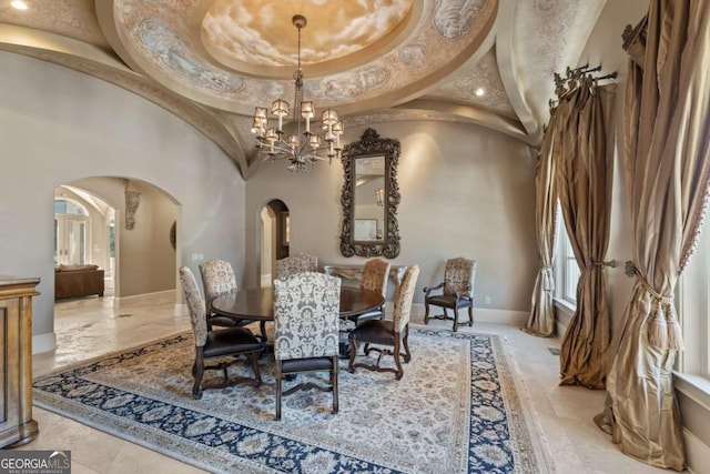 720 Heards Ferry Rd, Atlanta, GA 30328 - dining room with recessed lighting, a towering ceiling, marble finish floor, arched walkways, and a notable chandelier