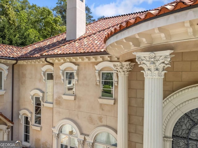 720 Heards Ferry Rd, Atlanta, GA 30328 - view of side of property featuring a tile roof and a chimney