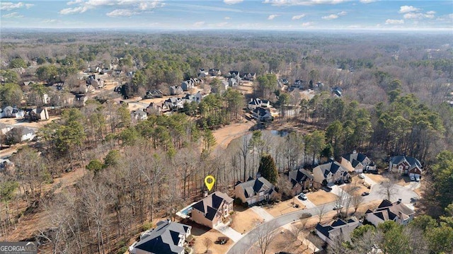 bird's eye view with a forest view and a residential view