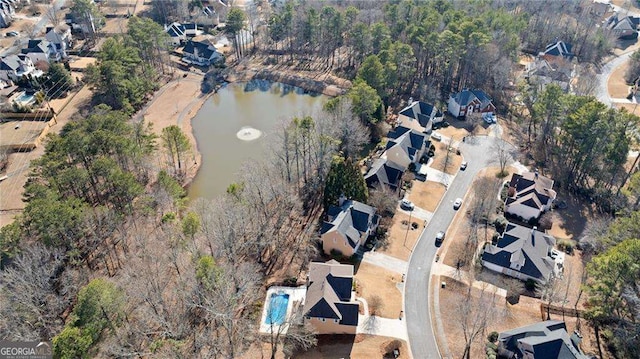 bird's eye view with a residential view and a water view