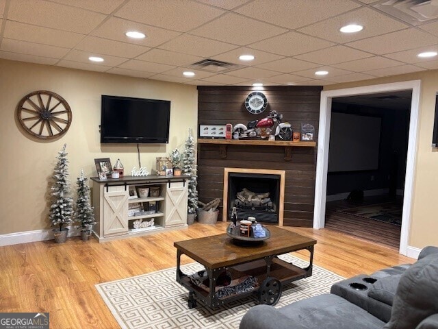 266 W Troutman Rd NE, Rome, GA 30165 - living area featuring visible vents, wood finished floors, baseboards, and a fireplace