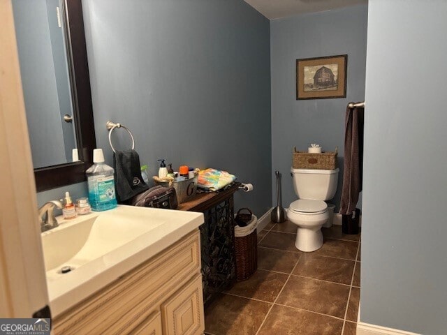 266 W Troutman Rd NE, Rome, GA 30165 - half bathroom featuring baseboards, tile patterned flooring, vanity, and toilet