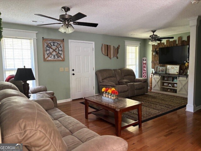 266 W Troutman Rd NE, Rome, GA 30165 - living room featuring ceiling fan, baseboards, wood finished floors, and a textured ceiling